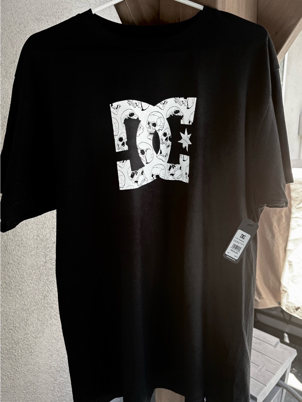 DC Black T‑Shirt with White Skull Logo